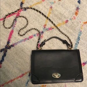 Black purse with gold chain